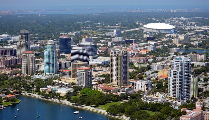 Air conditioning repair technician servicing HVAC unit in Pinellas County FL